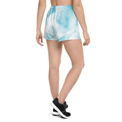 Blue tie dye womens shorts trunks on female model with a back view