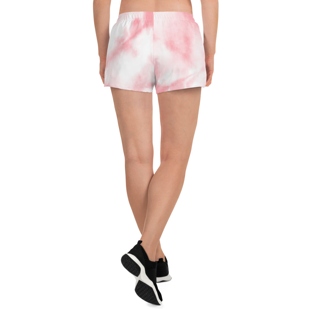 Pink tie dye womens shorts trunks on female model with a back view