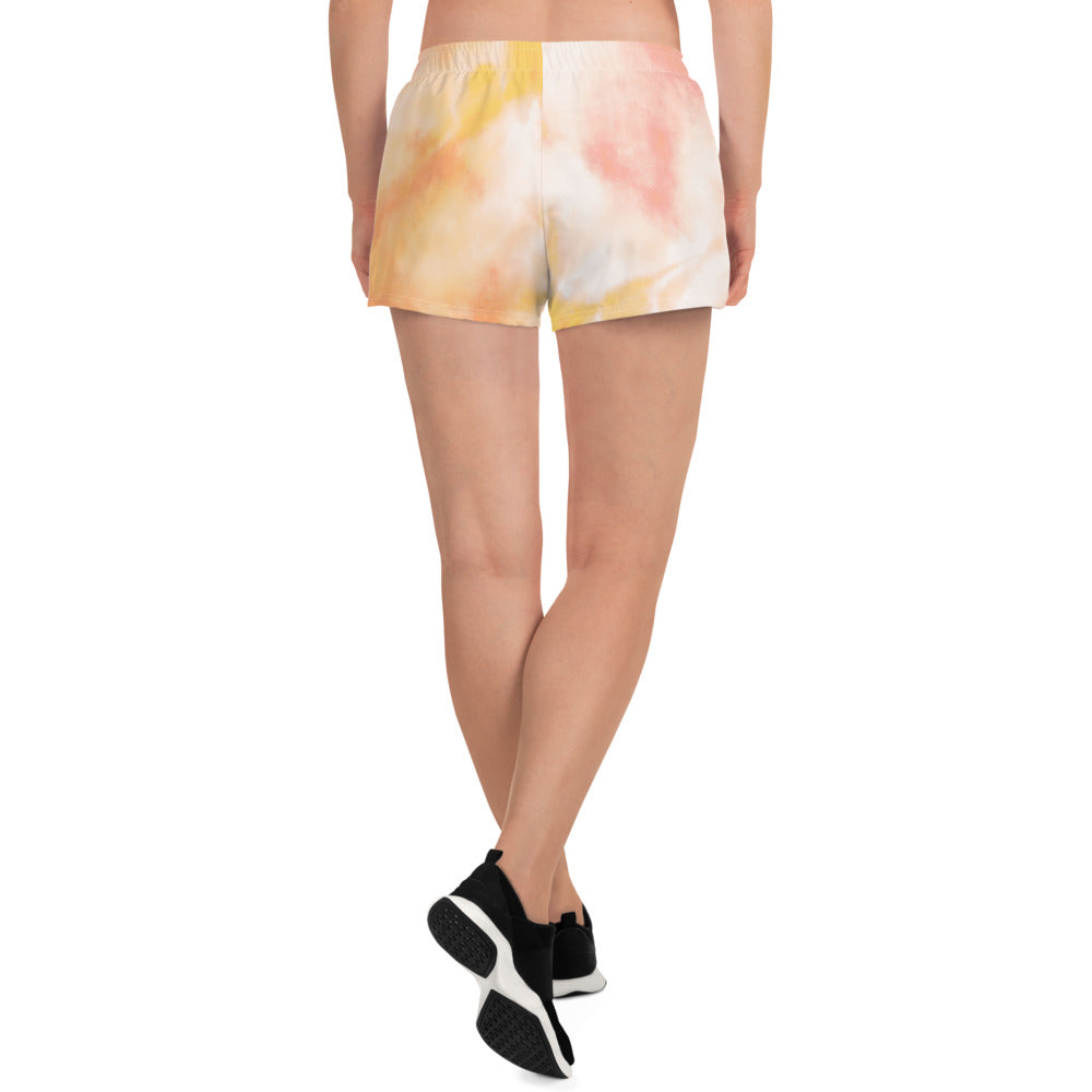 Sunburst tie dye womens shorts trunks on female model with a back view