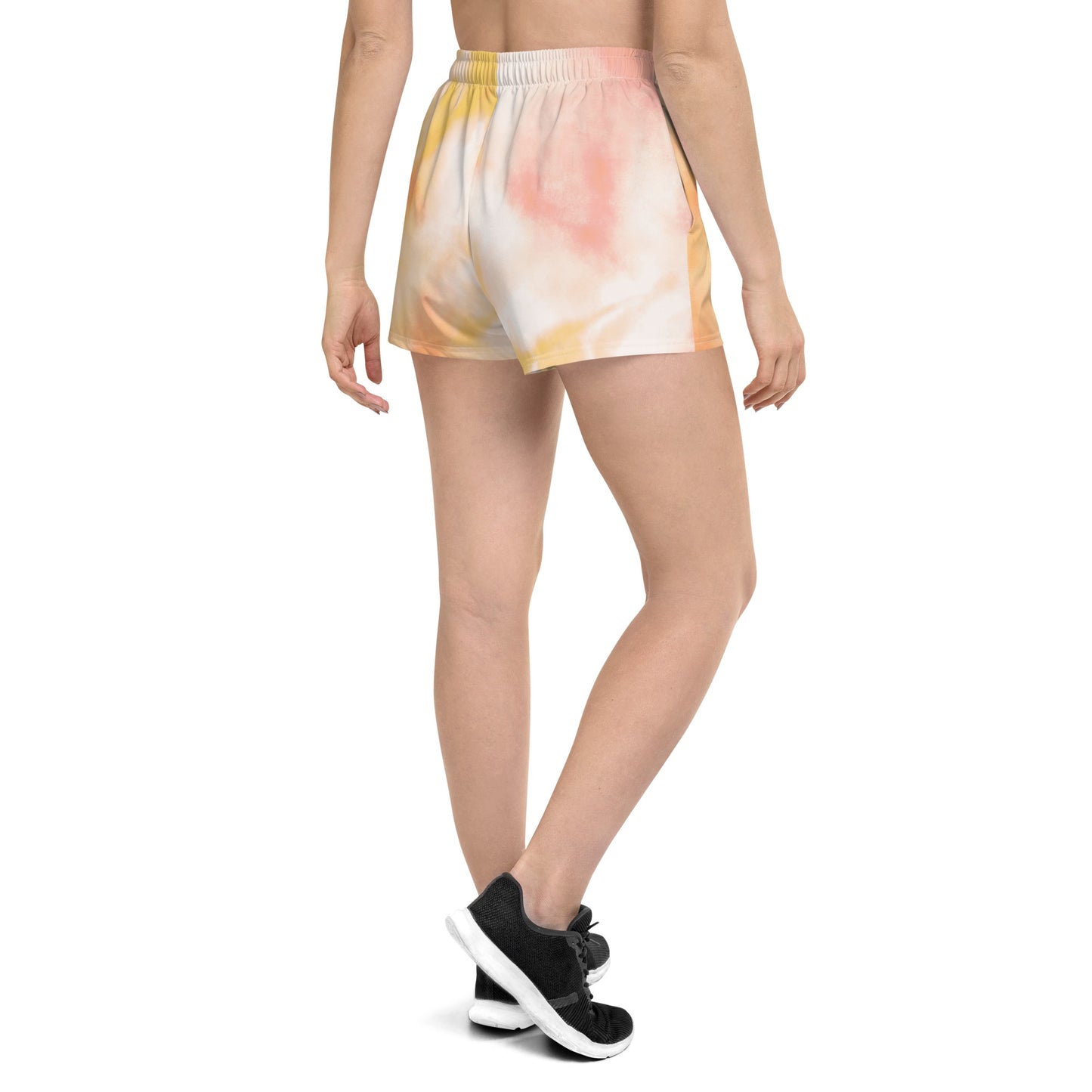 Sunburst tie dye womens shorts trunks on female model with an angled back view